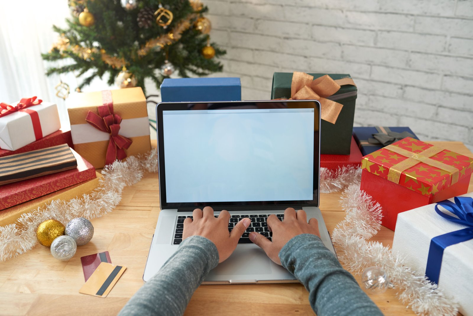 hands unrecognizable man buying presents online scaled